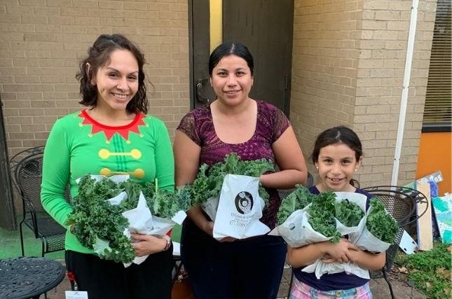 El Centro staff guide patients through harvesting fresh veggies.